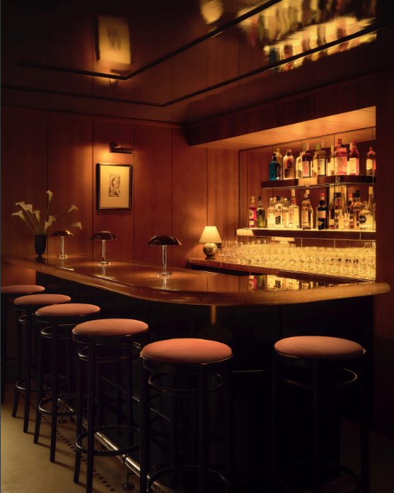 Duke74 downstairs bespoke bar with polished wood and brass fittings