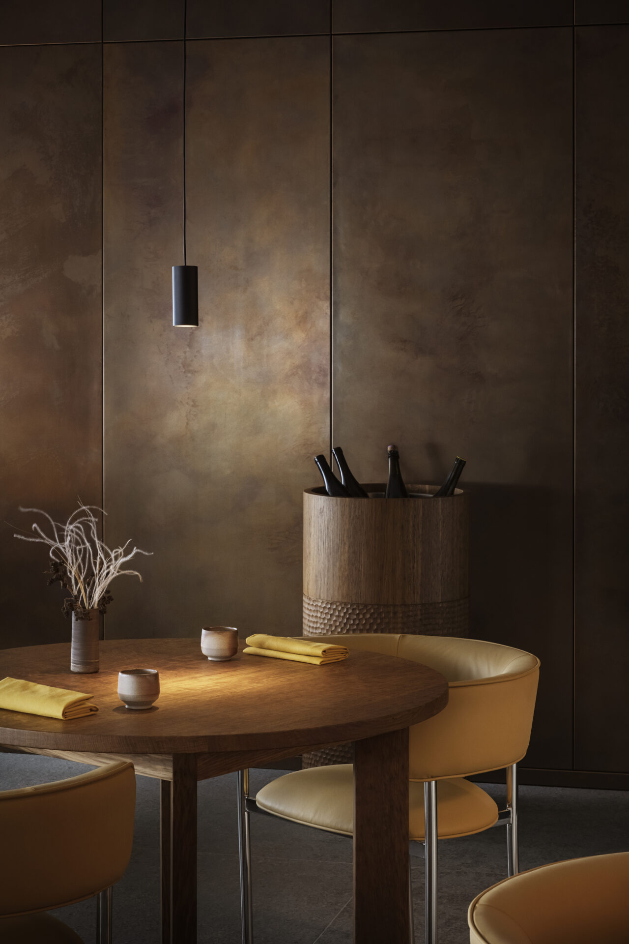 Copper-clad dining nook with timber joinery built from carefully selected materials