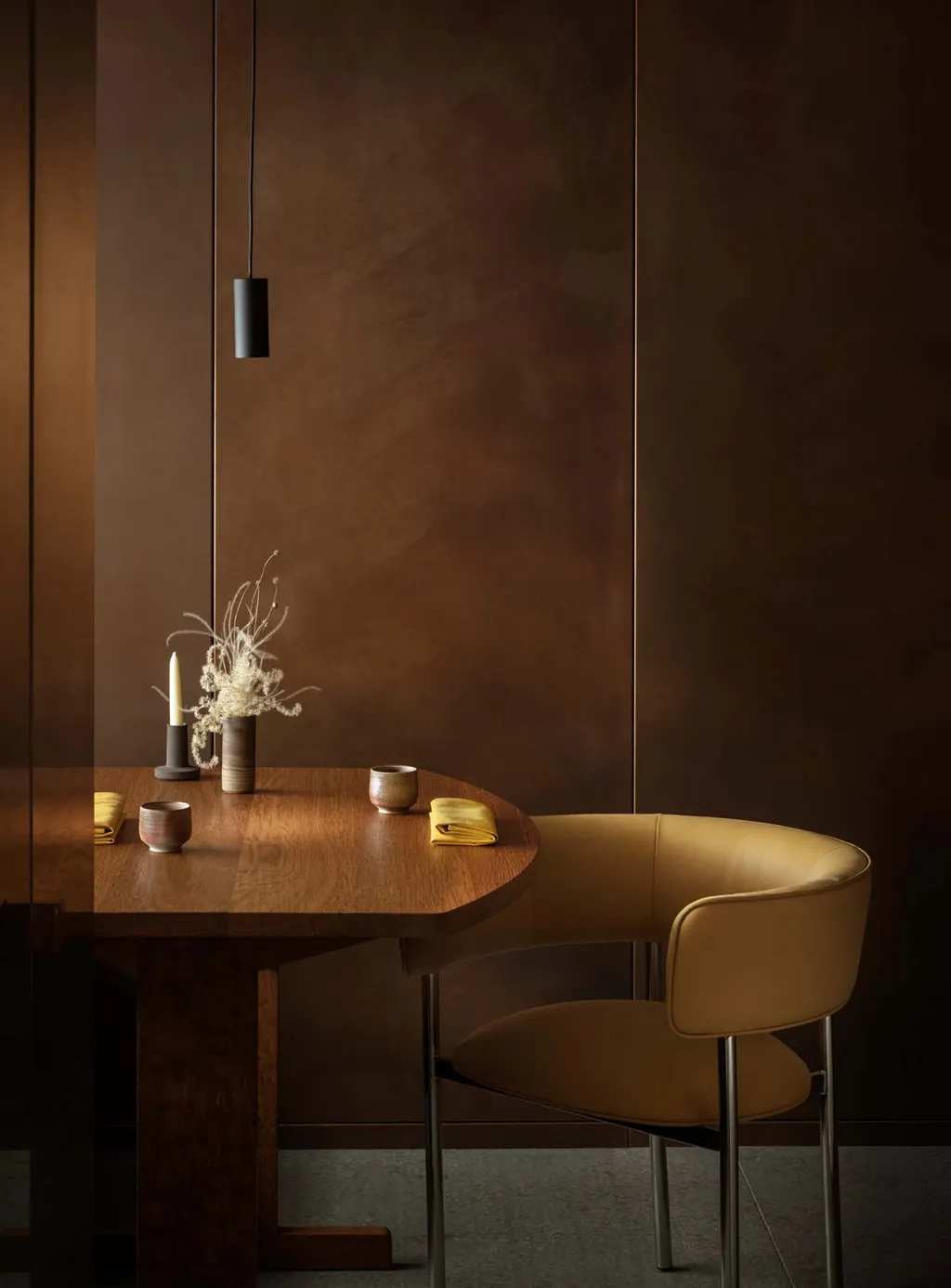Hand-finished copper and timber table detail in a bespoke restaurant interior