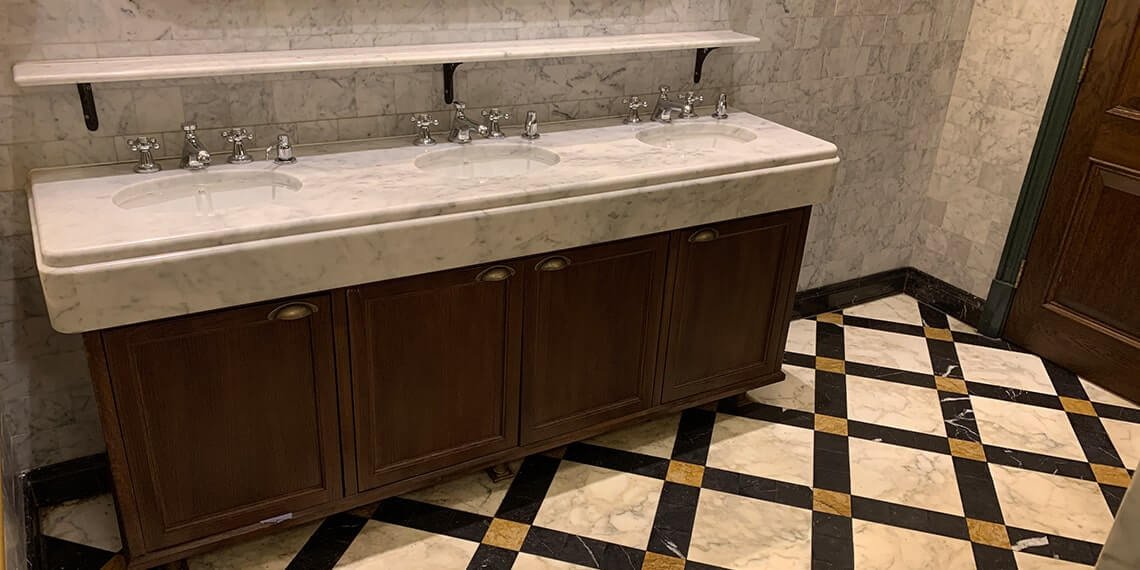 Panelled washroom vanity in stone and timber built for longevity